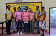 Lions Club members at the Henrietta office with the children’s relatives after presentation of the monetary donation