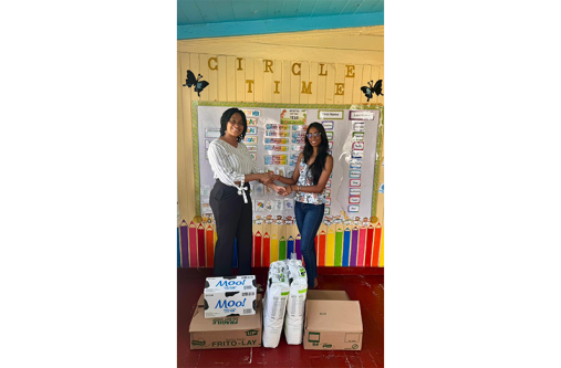 A representative of the Dharmic Naujawaan hands over a quantity of essential items to M.E.T Pride Academy Special Needs School & Therapy Center