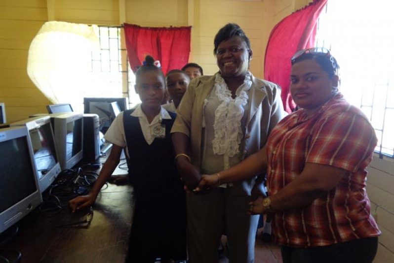 Michelle Barton head of Gibson Primary School, at left, and Natasha Baburam, Committees Manager for Food For The Poor