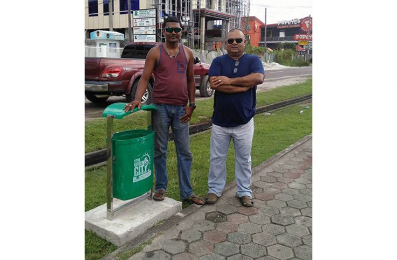 Head of Solid Waste Management Walter Narine (left) and newly appointed Deputy Mayor Lionel Jaikaran, during the exercise.