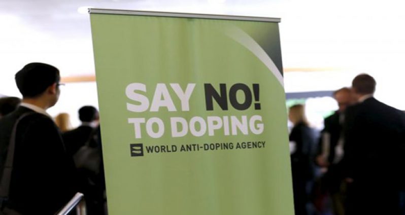 Participants talk before the start of World Anti-Doping Agency (WADA) Symposium in Lausanne earlier this year.