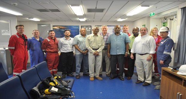 President David Granger (sixth left); Alliance for Change Executive Member, Mr Rafael Trotman (fifth left); and Minister of State within the Ministry of the Presidency, Mr Joseph Harmon (ninth left), with the crew of the ExxonMobil drill ship