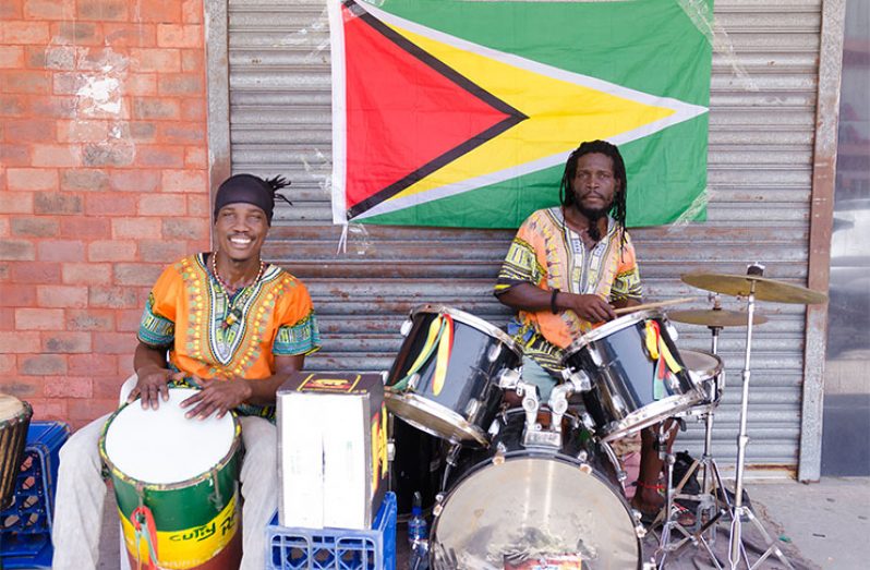 Drummer Curt Hunt (right) and his drumming partner said that they practice drumming to keep the African culture alive (Delano Williams photo)