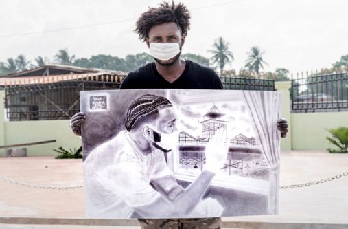 Jamal Durant holding up his iconic artwork (Source: Jamal Durant)