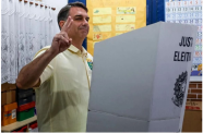 Flávio Bolsonaro casts his vote at a polling station in Rio de Janeiro (Reuters photos)