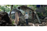 A UNICEF water and sanitation (WASH) specialist inspects the damage caused by the earthquake in Mele Maat village, about 10 kilometres northwest of Port Vila, the capital of Vanuatu (UNICEF/Damian Mobbs)