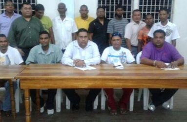 The newly elected executives of the East Bank Demerara Cricket Association strike a pose following their appointment last month. Sitting at centre is Anand Kalladeen, with Johnny Azeez (2nd right) and Rohan Sarjoo (right).