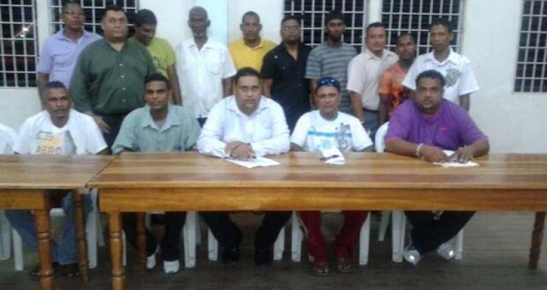 The newly elected executives of the East Bank Demerara Cricket Association strike a pose following their appointment last month. Sitting at centre is Anand Kalladeen, with Johnny Azeez (2nd right) and Rohan Sarjoo (right).