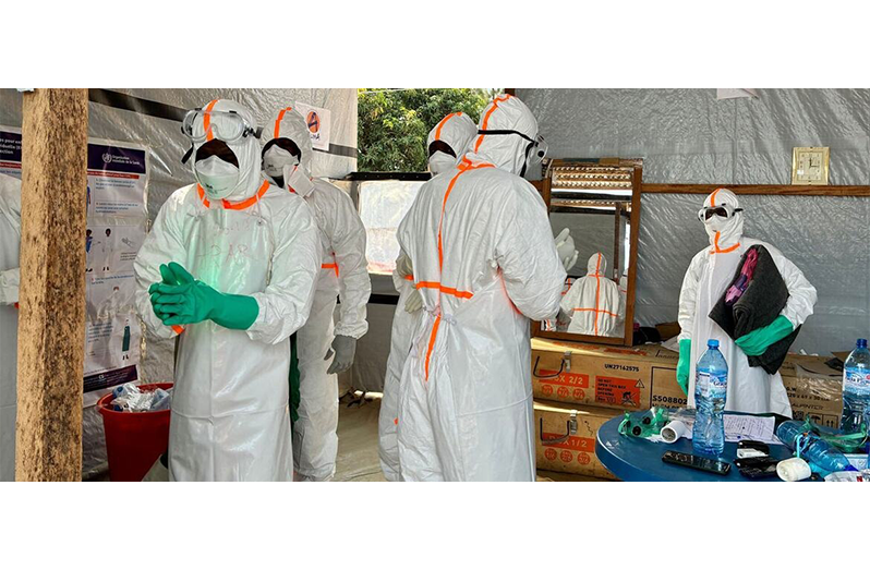 Health workers gather at an Ebola treatment centre in Bunia, in the eastern DR Congo (WHO/Grainne Harrington photo)