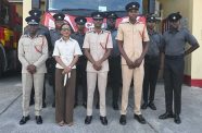 Minister Walrond with senior fire officials and firefighters at the Eccles Fire Station on Saturday (Photos: Ministry of Home Affairs/Facebook)