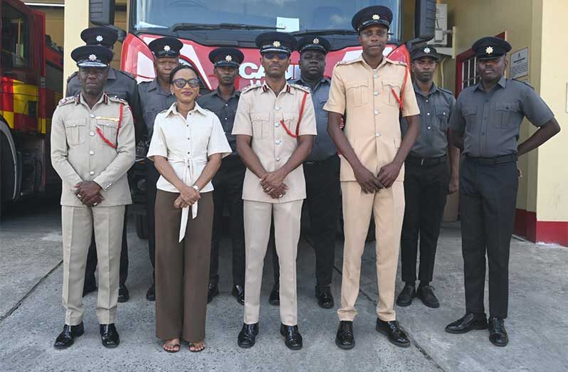 Minister Walrond with senior fire officials and firefighters at the Eccles Fire Station on Saturday (Photos: Ministry of Home Affairs/Facebook)