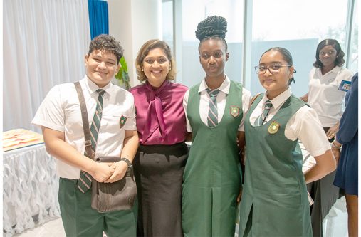 Minister of Education, Priya Manickchand shares a light moment with students (Delano Williams photo)