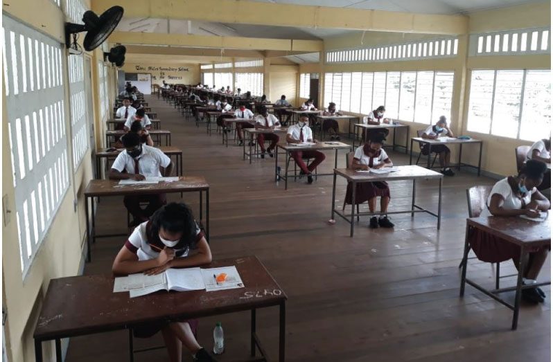 Students of the Three Miles Secondary School in Bartica writing a CSEC examination in 2020