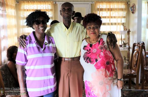 James Barrington Layne with Social Protection Minister, Amna Ally and Parliamentarian, Jennifer Wade