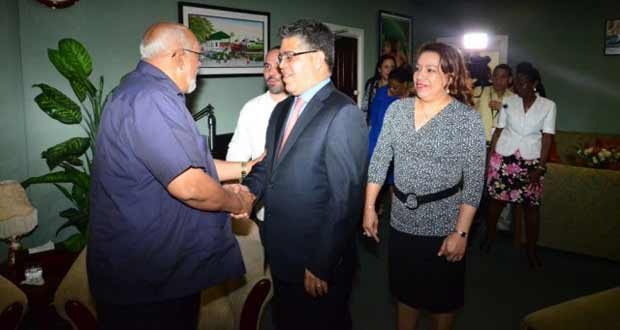 President Donald Ramotar greets Venezuelan Foreign Minister Elias Jaua at the Cheddi Jagan International Airport. Also in photo is Minister of Foreign Affairs Carolyn Rodrigues-Birkett