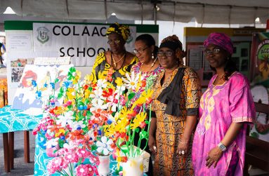 Members of ACDA COLACCO pose for a picture in their booth.