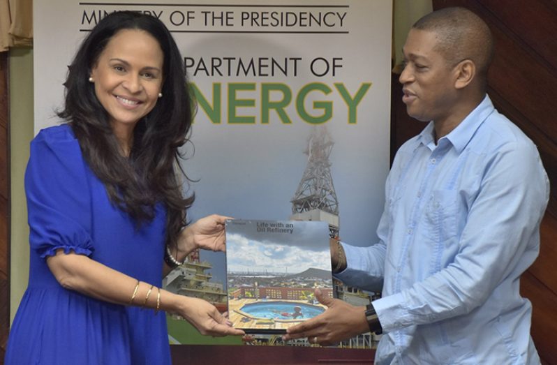 Minister of Economic Development, Honourable Giselle McWillliams presents Director, Department of Energy, Dr. Mark Bynoe with a token of appreciation at the close of the meeting