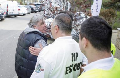 Romania's head coach Ilie Nastase is escorted by stewards outside the arena where the FedCup Group II play-off match between Romania and Great Britain takes place, in Constanta county, Romania, April 22, 2017. Inquam Photos/George Calin/via REUTERS