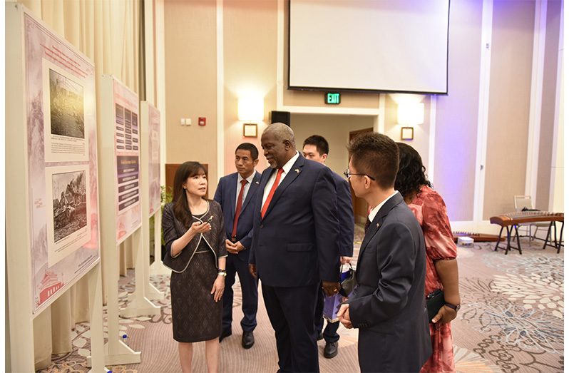 Prime Minister Brigadier (ret'd) Mark Phillips, Chinese Ambassador to Guyana Yang Yang, along with other officials at the celebration of the 76th Anniversary of the founding of the People’s Republic of China (Chinese Embassy in Guyana photo)