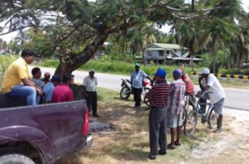 Extension Officers in Region Two, meeting with some rice farmers