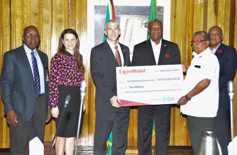 From left to right: ExxonMobil Guyana officials Carlton James and Kimberly Johnson-Brasington;  ExxonMobil Guyana Country Manager, Rod Henson; Minister of State, The Hon Joseph Harmon; Director-General of the CDC ,Col. Chabilal Ramsarup  and Minister of Natural Resources, The Hon Raphael G. C. Trotman, M.P.