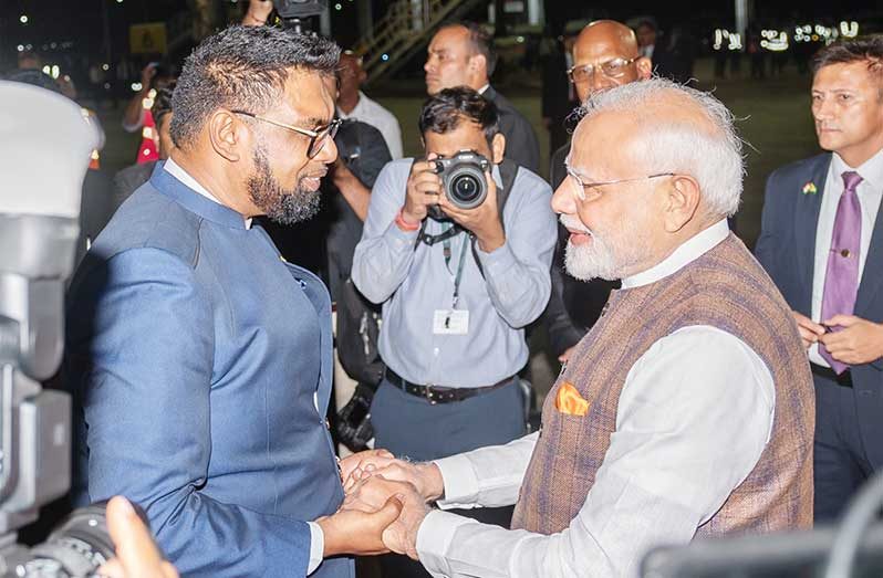 President Dr. Irfaan Ali and India’s Prime Minister Shri Narendra Modi greet at 
the Cheddi Jagan International Airport. PM Modi who is on a three-day state 
visit to Guyana arrived in Guyana on Tuesday night