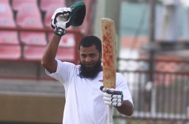 Assad Fudadin acknowledges his teammates after reaching his seventh first-class hundred.
