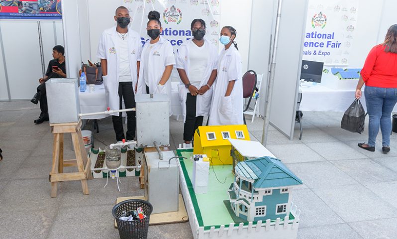 The Bush Lot Secondary School team showcasing their model of the eco-friendly incinerator,