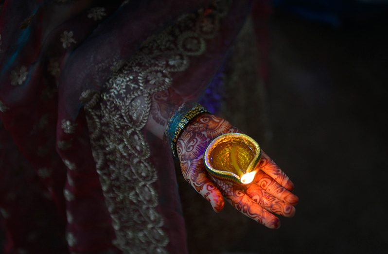 A Pakistani Hindu family offers prayers and light candles as they mark Diwali, the Festival of Lights, in Lahore, 2016. Arif Ali/AFP/Getty Images
