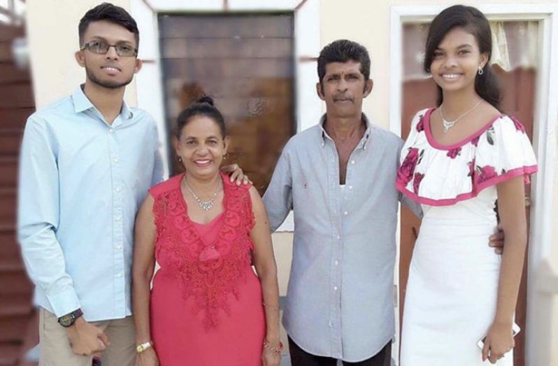 Mahendra Phagwah (left) with his parents and sister Priya (right)