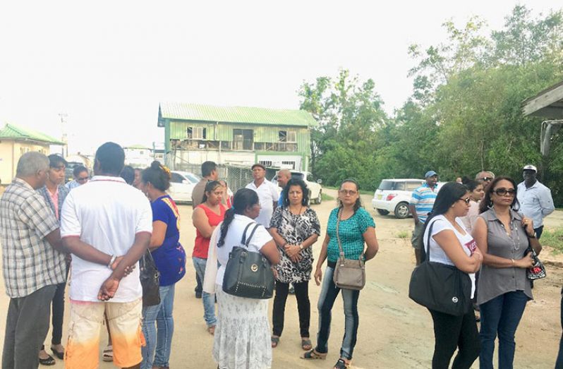 Concerned fisherfolk and family members of the missing fishermen at the Waldring Dock in Paramaribo 