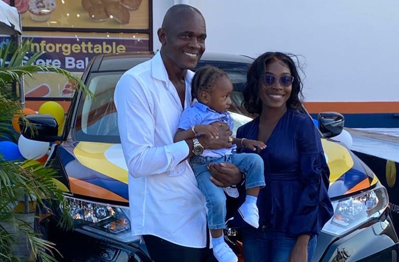 The winner of a brand-new 2022 Nissan X-Trail, Colin Weeks with his wife Dominique Williams and their son