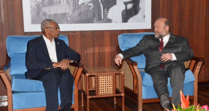 President David Granger in discussion with United States Ambassador to Guyana, Perry Holloway (right), during the latter’s courtesy call on the President at the Ministry of the Presidency