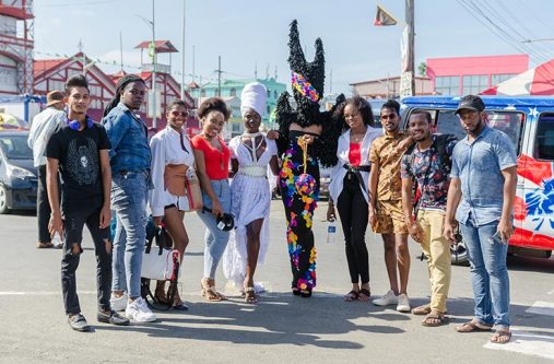 Designers Mwanza Glenn (right) and Mark Junor (second from left) with the other creatives working to bring awareness to COVID-19 (Delano Williams photo)