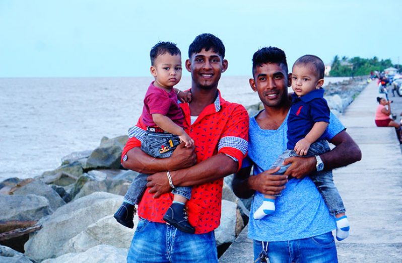 Two cousins and their sons. Roshan Sukhran and his son Aaiduyn Sukhran (left) and Emran Ramnarina and his son Adon Ramnarina (right)