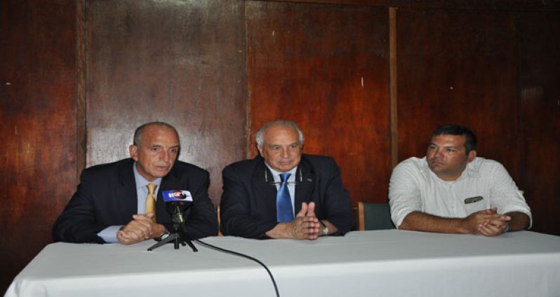 FIH president Leandro Negre (centre) makes a point during Tuesday’s press conference at the GCC pavilion. At left is Pan American Hockey Federation president Alberto `Coco’ Budeisky, while at right is GHB president Philip Fernandes.