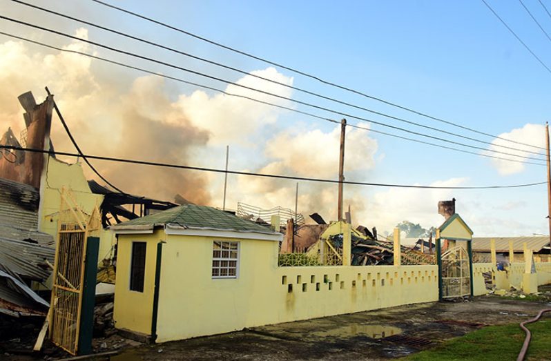 The flattened structure of Supra International that went up in flames on Saturday (Adrian Narine photo)