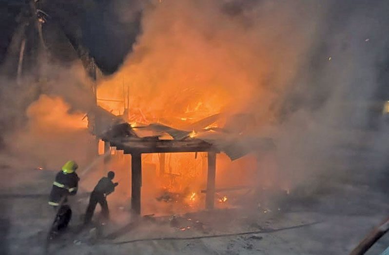Fire fighters battling the early-morning fire (Deron Adams photo)