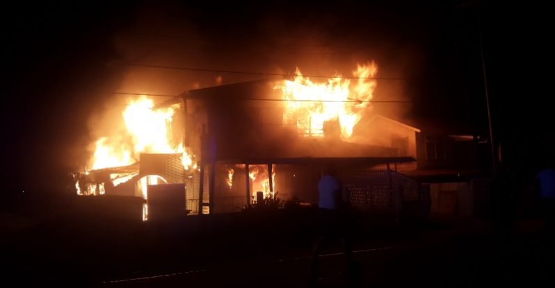 What remains of the two-storeyed house after the fire ||Owner of the house Gertrude Vieira (Photos by Elvin Croker)