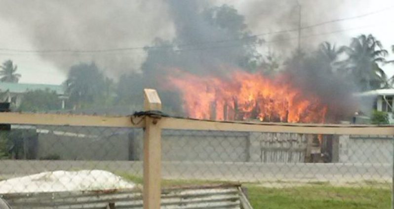 The house while it was on fire (Photos by Samuel Maughn)