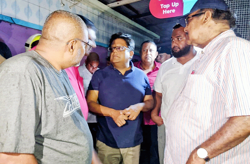 Senior Minister in the Office of the President with Responsibility for Finance Dr. Ashni Singh; Minister within the Ministry of Local Government and Regional Development Anand Persaud; Regional Chairman David Armogan; Regional Vice-Chairman Zamal Hussein; Regional Executive Officer Narendra Persaud; and Mayor of Corriverton Imran Amin at the fire scene on Monday night
