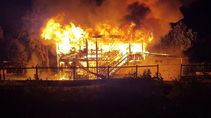 The house ablaze.
