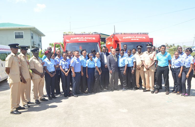 Minister of Public Security Khemraj Ramjattan and Health Minister Dr George Norton with members of the Guyana Fire Service and Emergency Medical Technicians