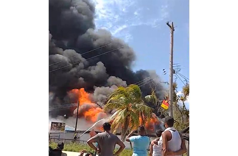 A fireman works to contain the blaze at Charity