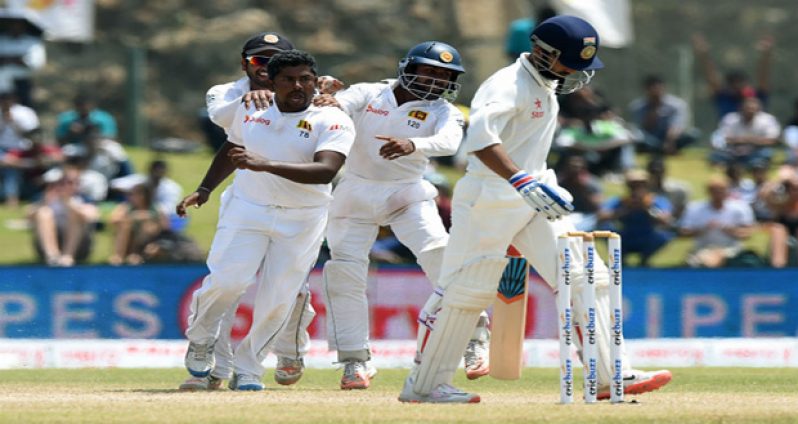 Rangana Herath is all fired up after getting the wicket of Ajinkya Rahane on the fourth day in Galle.