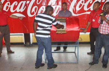 In this Sonell Nelson photo, Patrick Clarke was the first to dip into the bin and extracted Ramlakhan’s name. Others in photo are from left: Carlton Joao, Jaikarran Mohan, Colin King and Troy Peters.