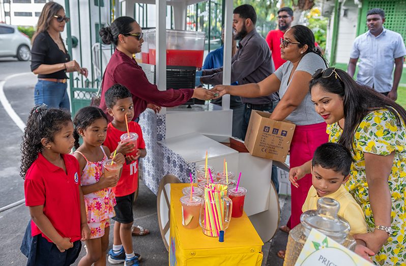 First Lady Arya Ali and First Son,Zayd Ali, interacting with supporters at the lemonade sale (Delano Williams photos)