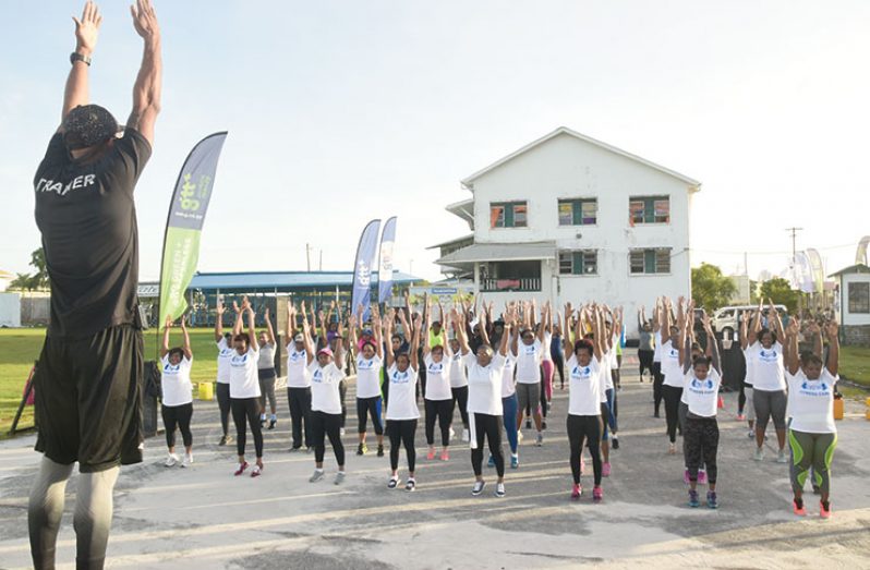 A fitness instructor taking some participants through warm-up drills on Day One of the GTT-Pulse Fitness Camp (Photo by Adrian Narine)