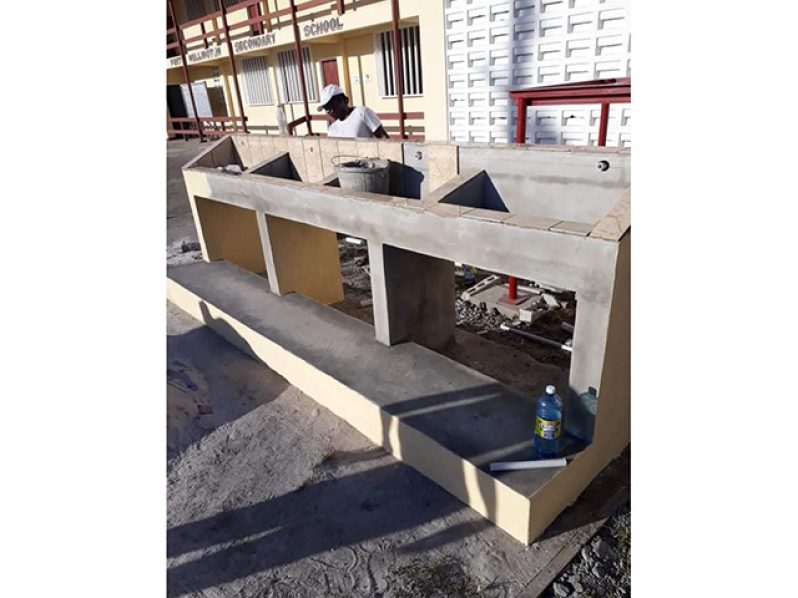 A contractor working on one of the many water troughs being constructed at a secondary school in Region Five (Ministry of Education photo)