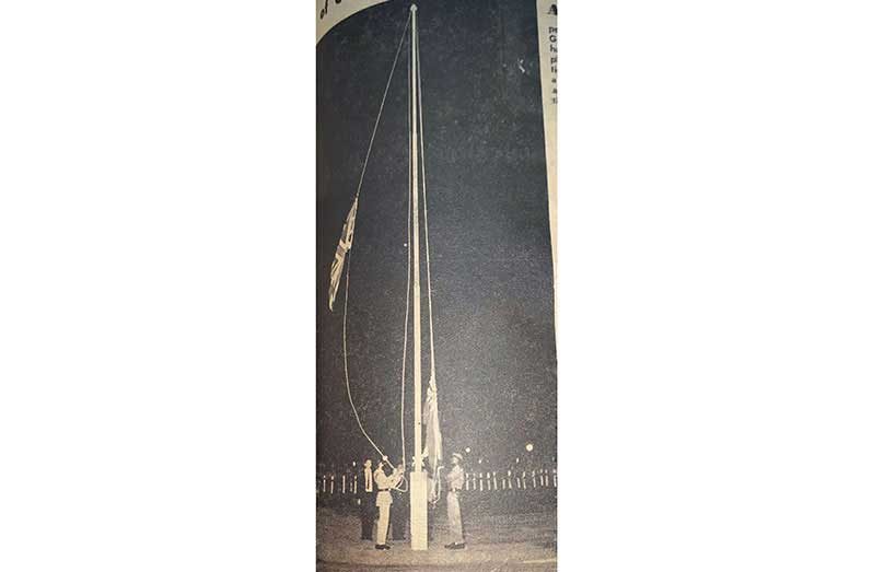 DOWN AND UP: Lights were dimmed as thousands of Guyanese watched the ceremony in 1966, when the Union Jack came down and the flag of Guyana went up to herald the birth of the new nation.